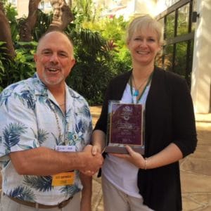 Monica receiving 2017 TCIA Professional Communications Award
